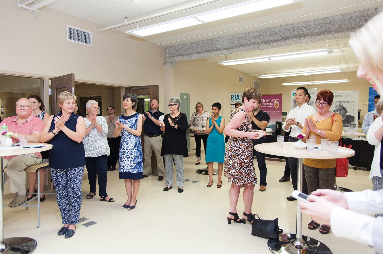 Group applauding a presenter